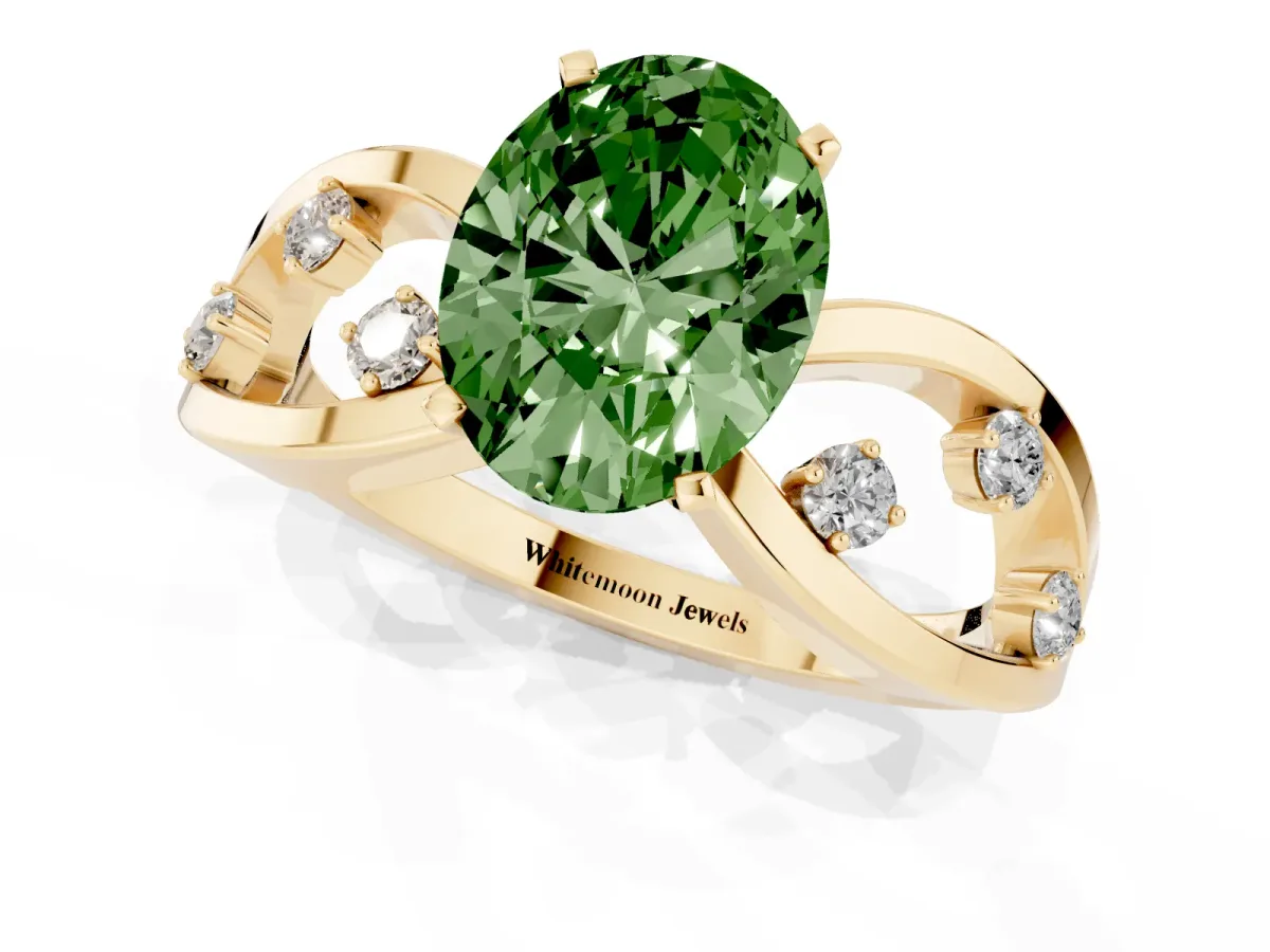 Fancy Green Oval Cut Cut Solitaire Diamond with Side Stones on Criss-Cross Band and Four-Prong Setting Yellow gold