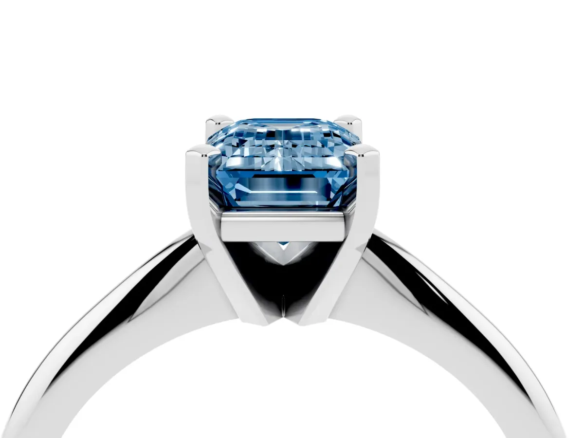 Fancy Blue Emerald Cut Cut Solitaire Ring with Four-Prong Setting on a Classic Band White gold