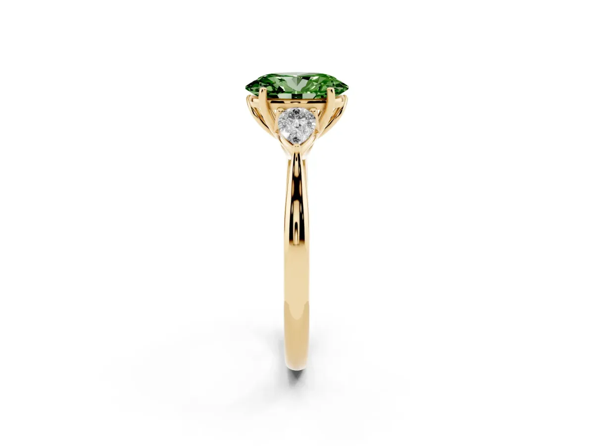 Fancy Green Three-Stone Oval Cut Brilliant Diamond Solitaire Ring with Tapered Band and Four-Prong Setting Yellow gold