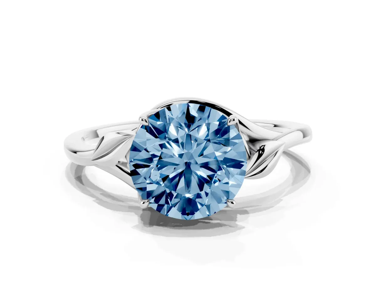 Fancy Blue Round Cut Diamond Solitaire Ring with Twist Band and Four-Prong Setting Silver