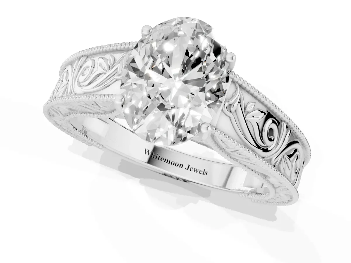 Oval Cut Diamond Solitaire Ring with Engraved Band and Four-Prong Setting Silver