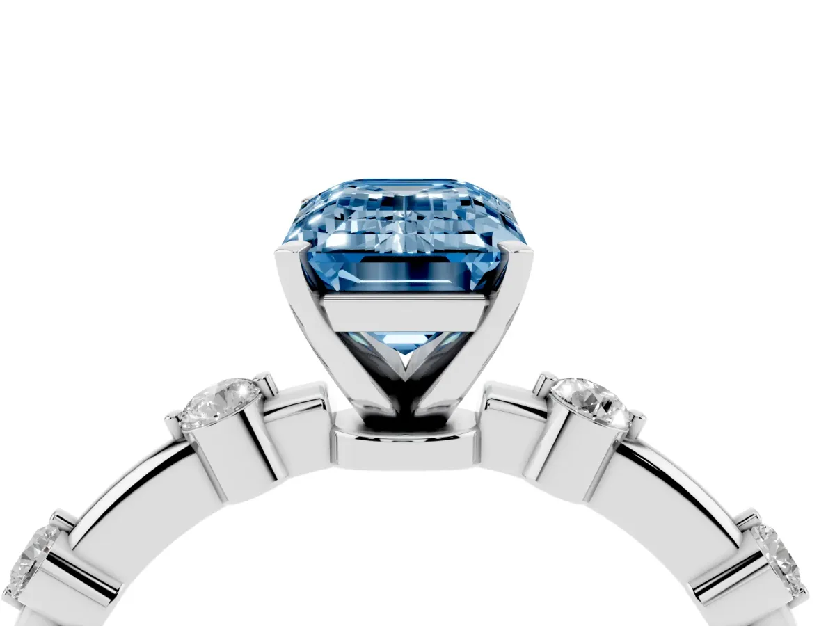 Fancy Blue Emerald Cut Solitaire Diamond Ring with Bezel Set Side Stones and Prong Setting Silver