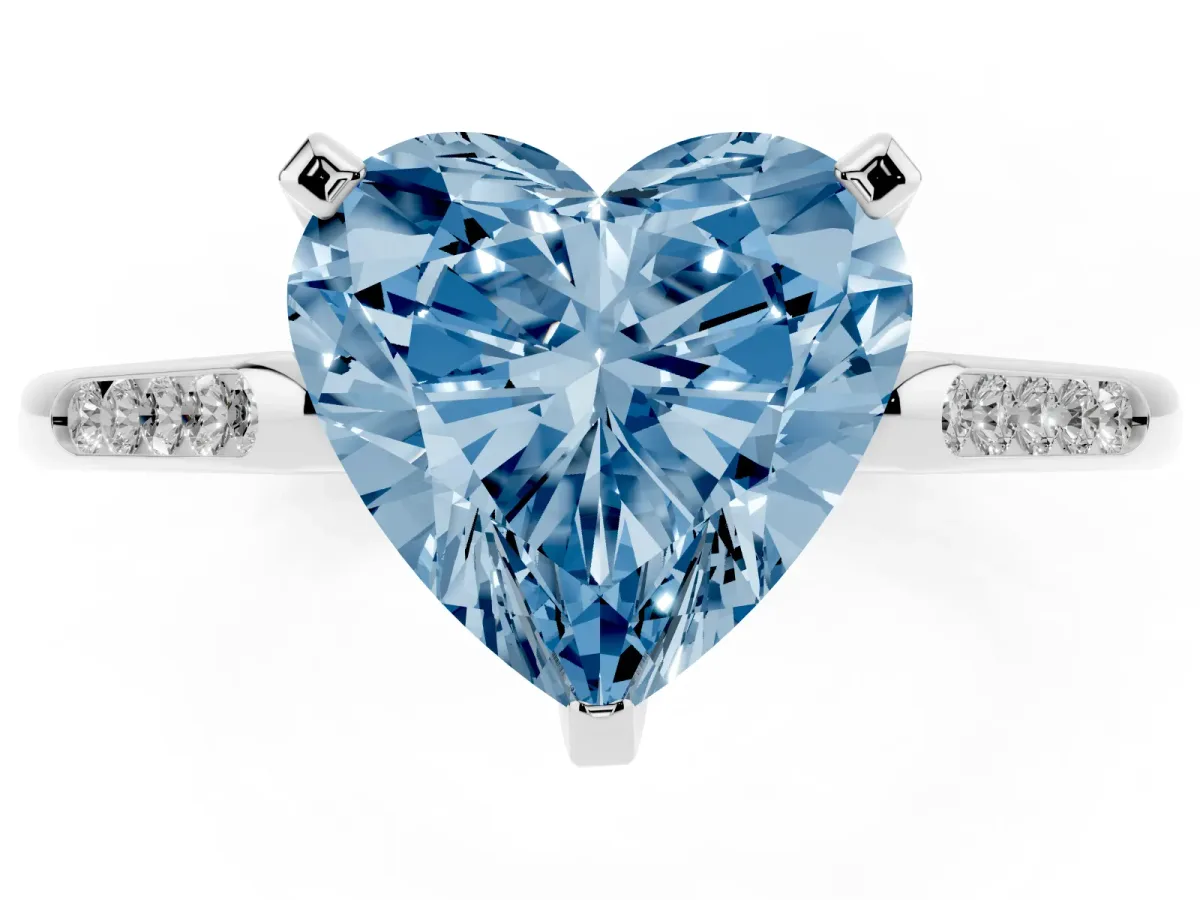 Fancy Blue Heart Cut Diamond Solitaire Ring with Channel Set Round Band and Prong Setting Silver
