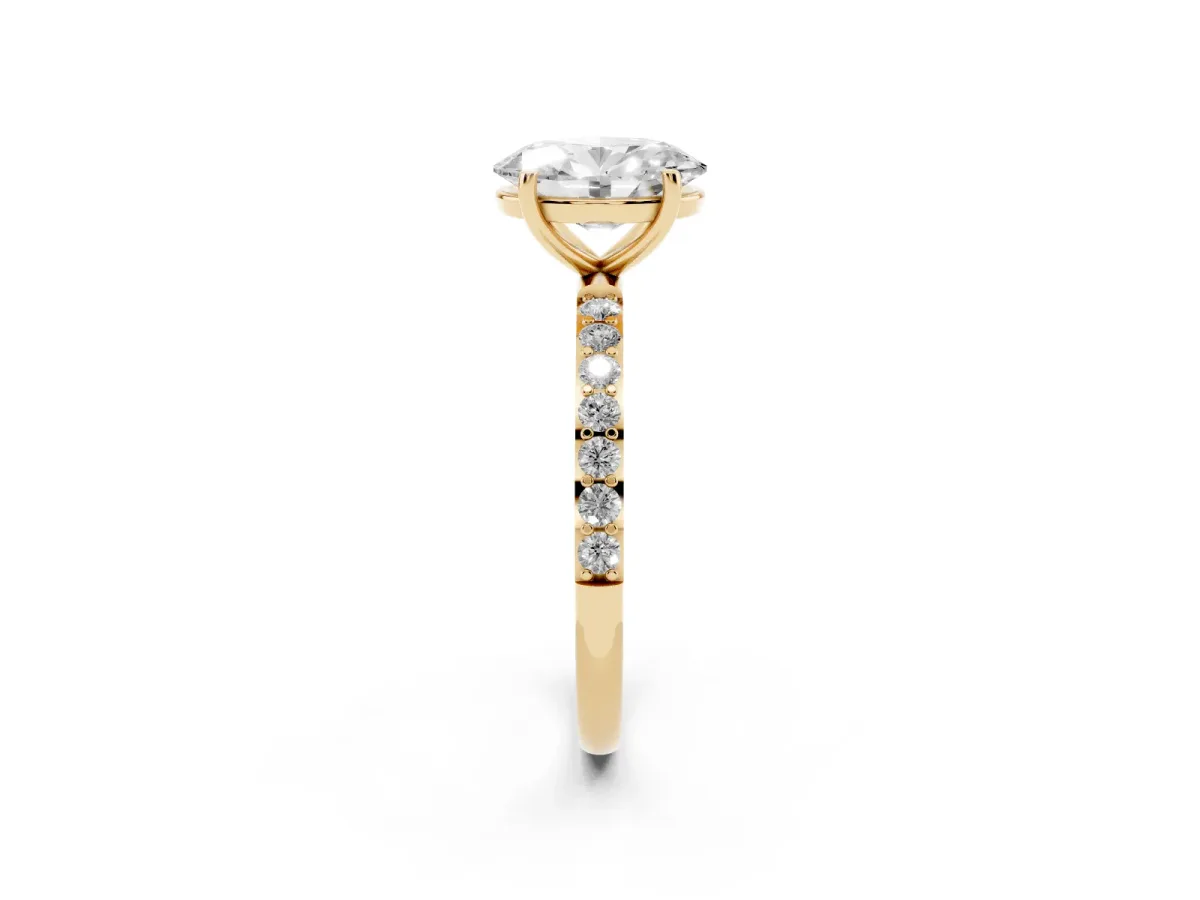 Oval Cut Diamond Solitaire Ring with Round Pavé Shoulders and Prong Setting Yellow gold