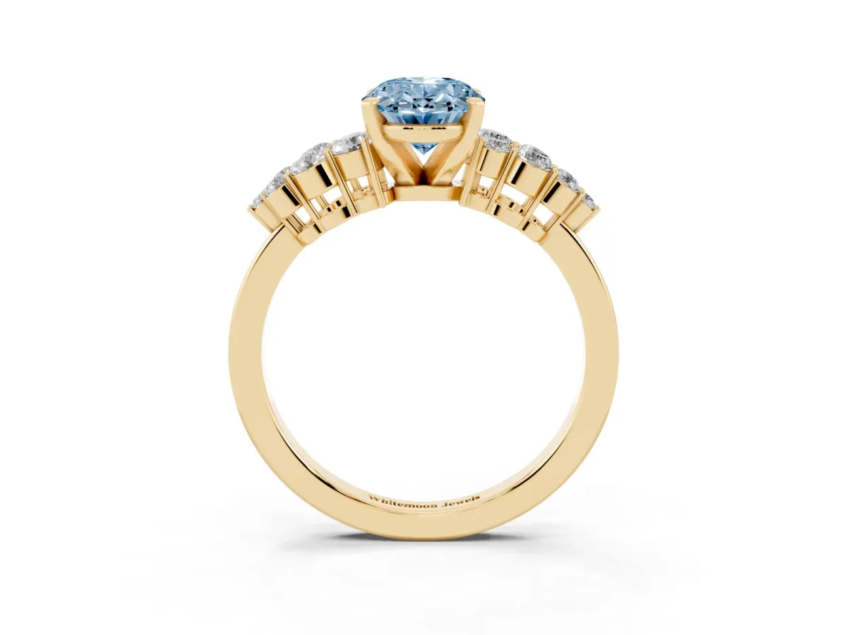 Fancy Blue Oval Cut Cluster Diamond Engagement Ring with Pavé Band and Four-Prong Setting Yellow gold
