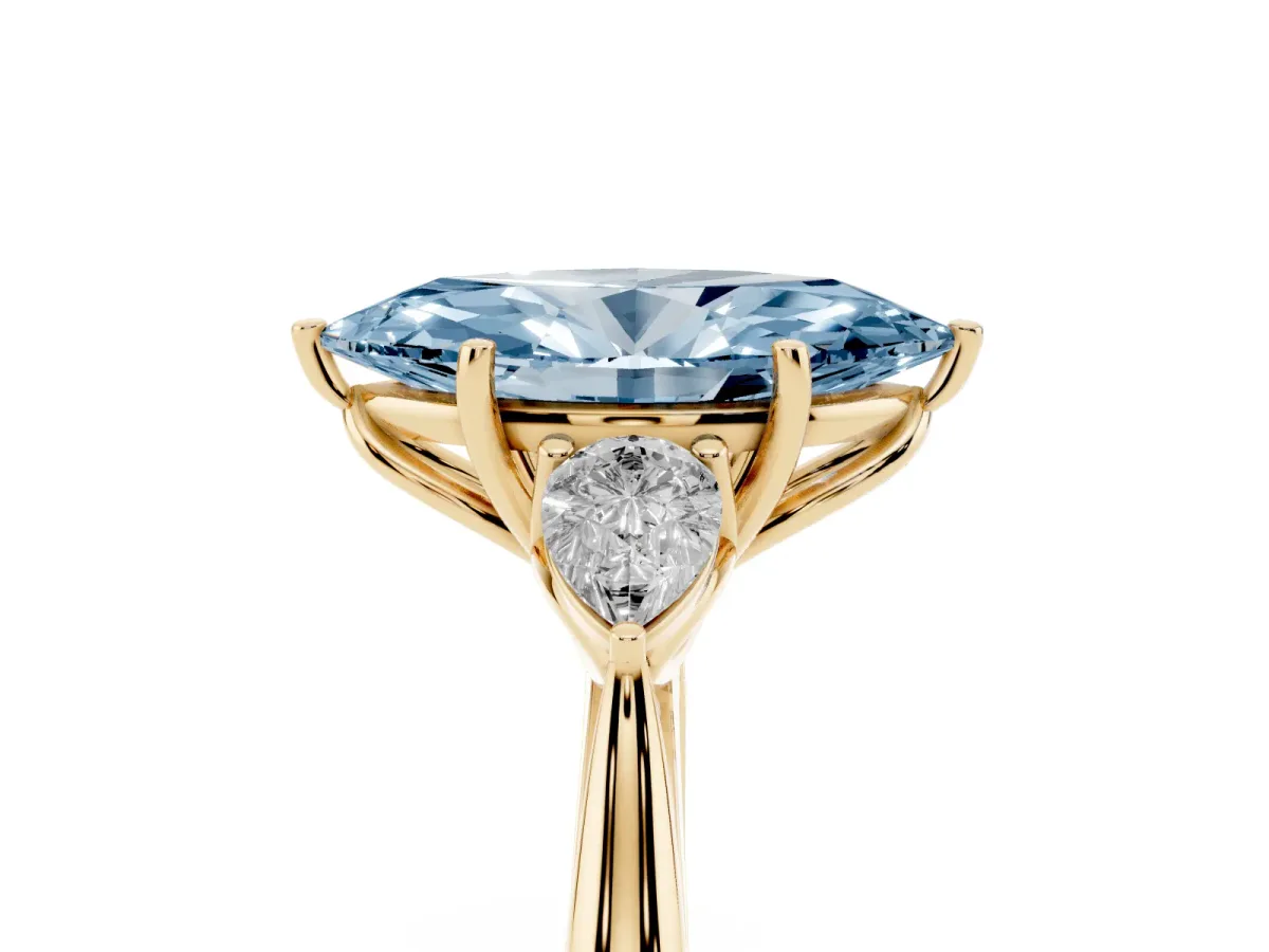 Fancy Blue Marquise Cut Diamond Three-Stone Ring with Pear Side Stones and Prong Setting Yellow gold