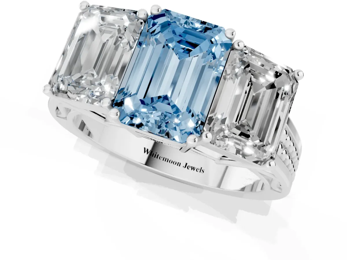 Fancy Blue Emerald Cut Diamond Three-Stone Ring with Prong Setting and Textured Band White gold