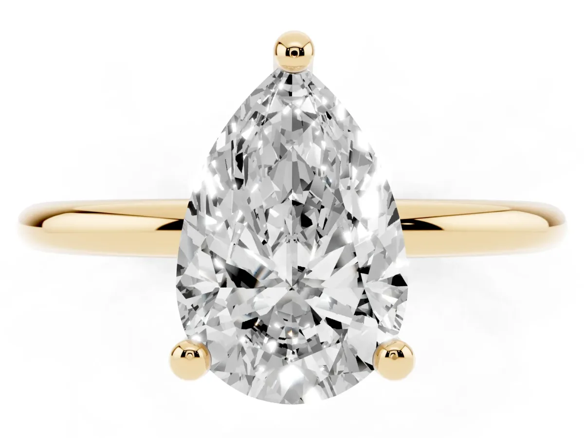 Pear Cut Solitaire Diamond Ring with 4-Prong Setting on a Classic Band Yellow gold