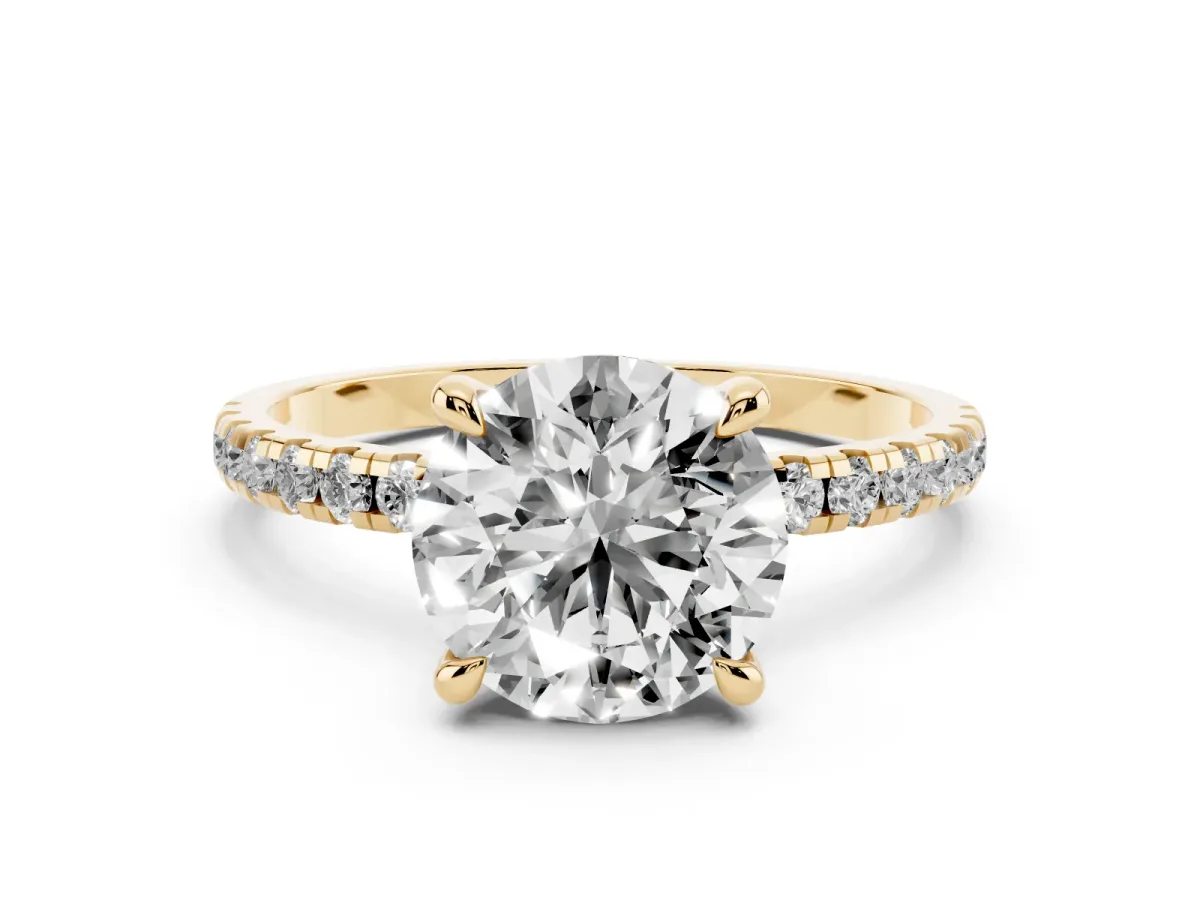 Round Cut Diamond Brilliant Solitaire Ring with Pavé Band and Four-Prong Setting Yellow gold