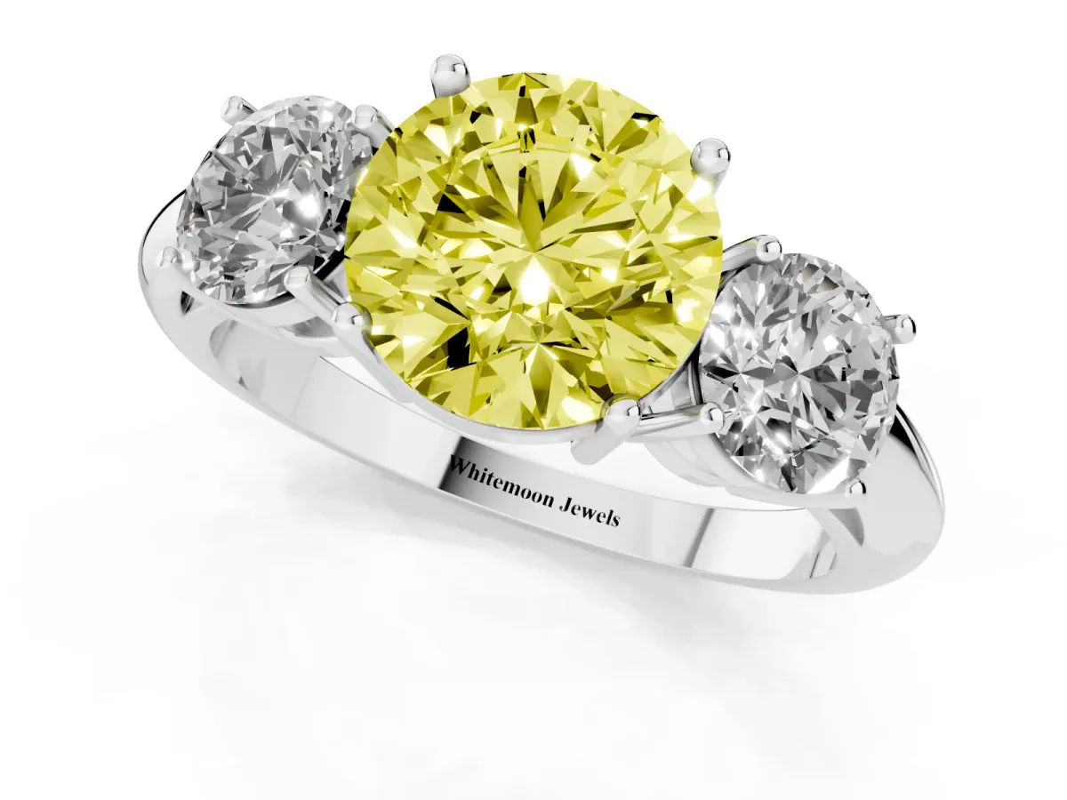 Fancy Yellow Three-Stone Round Cut Cut Diamond Engagement Ring with Prong Setting on a White Gold Band Silver