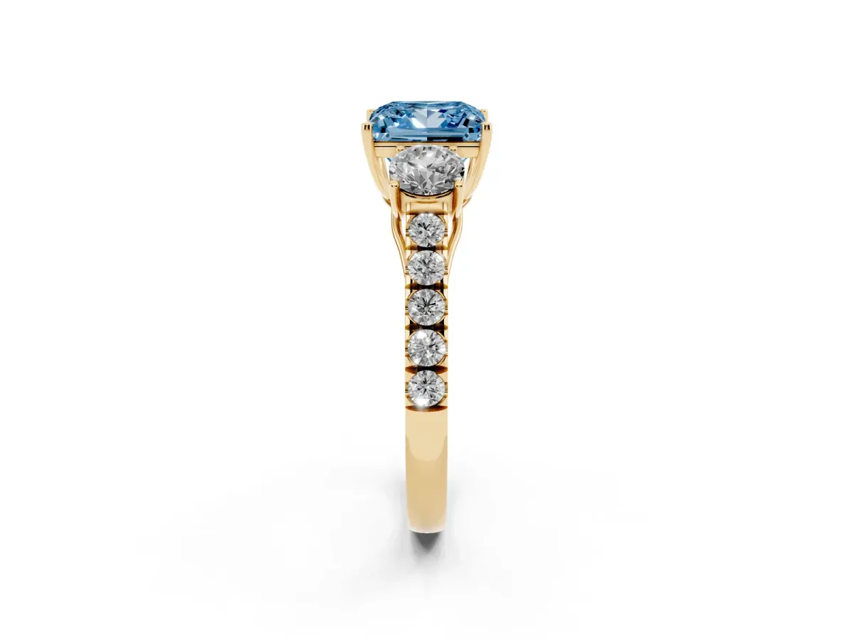 Fancy Blue Princess Cut Cut Diamond Three-Stone Ring with Round Side Stones and Pavé Band Yellow gold
