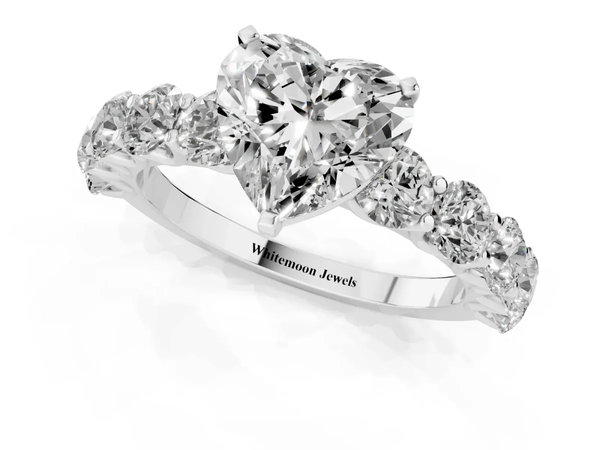 Heart Cut Diamond Prong Setting with Side Stones on a Pave Band Silver