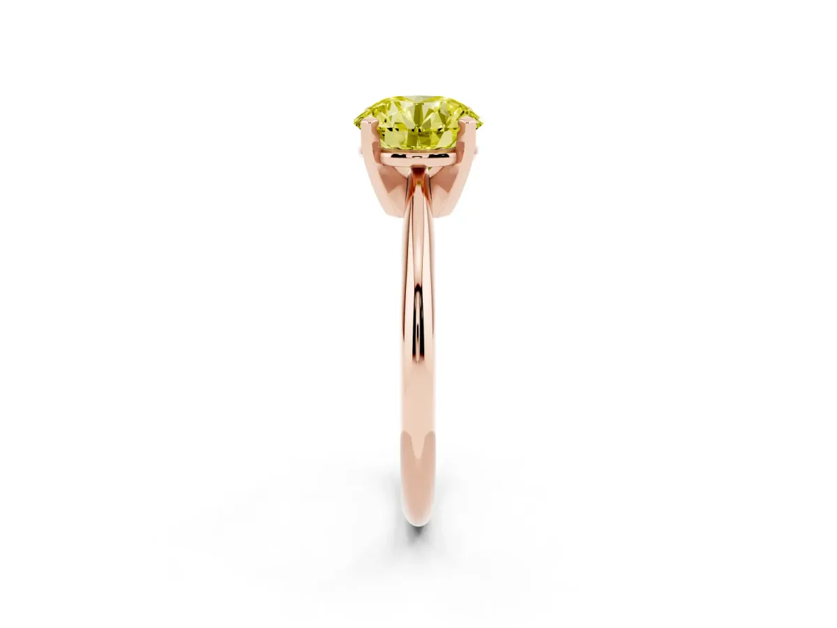 Fancy Yellow Round Cut Cut Solitaire Ring with Four-Prong Setting on a Classic Band Rose gold