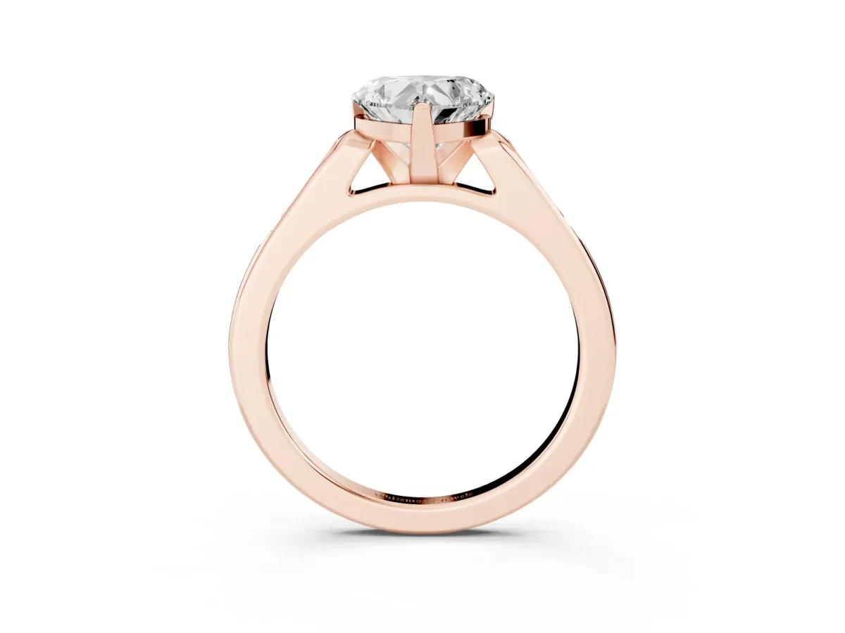 Heart Cut Diamond Solitaire Ring with Channel Set Round Band and Prong Setting Rose gold