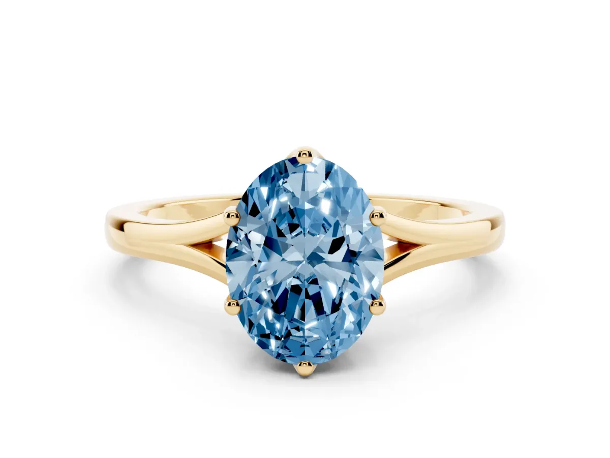 Fancy Blue Oval Cut Solitaire Diamond Ring with Six-Prong Setting and Tapered Band Yellow gold