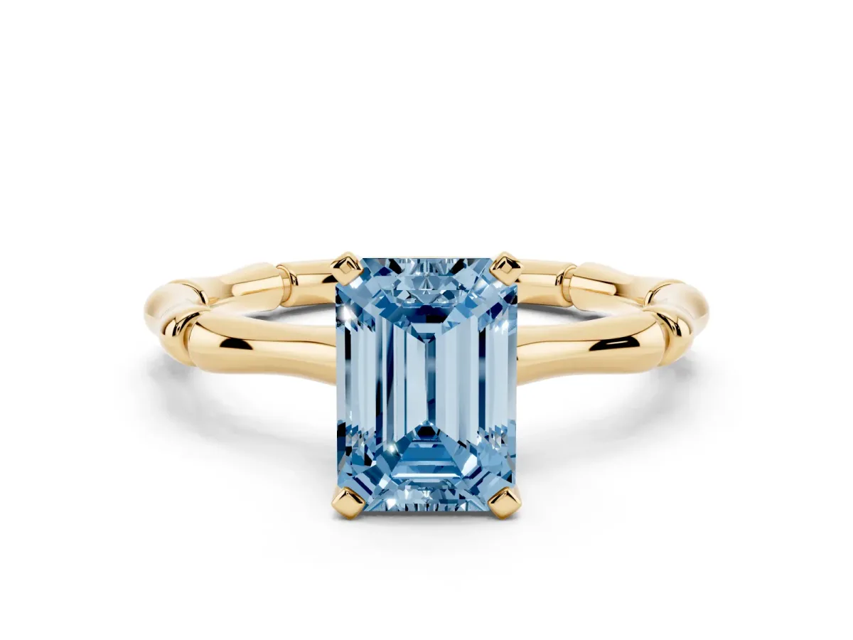 Fancy Blue Emerald Cut Solitaire Diamond Ring with Bamboo Band and Four-Prong Setting Yellow gold