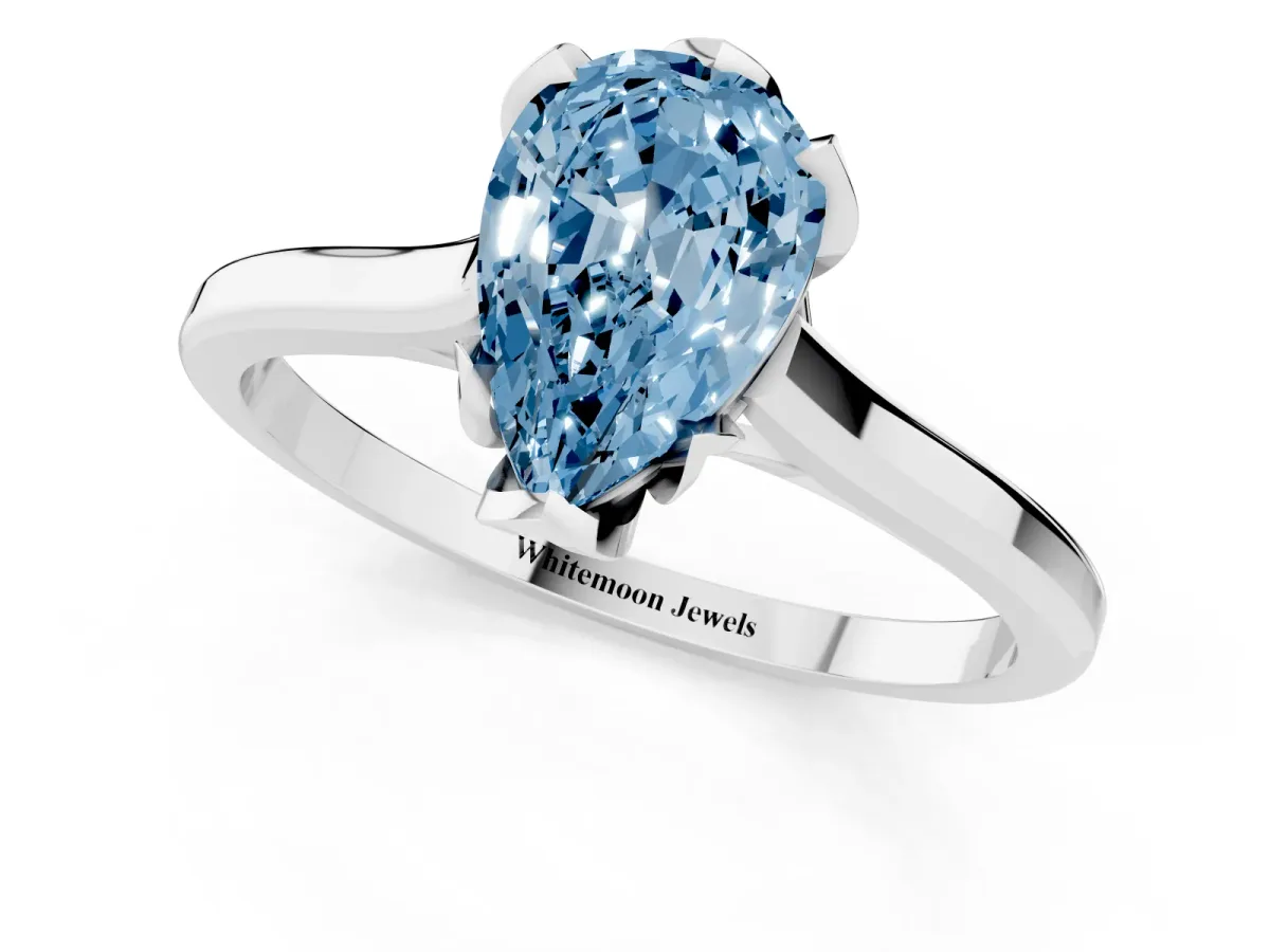 Fancy Blue Pear Cut Diamond Solitaire Ring with Flower Prong Setting and Classic Band Platinum