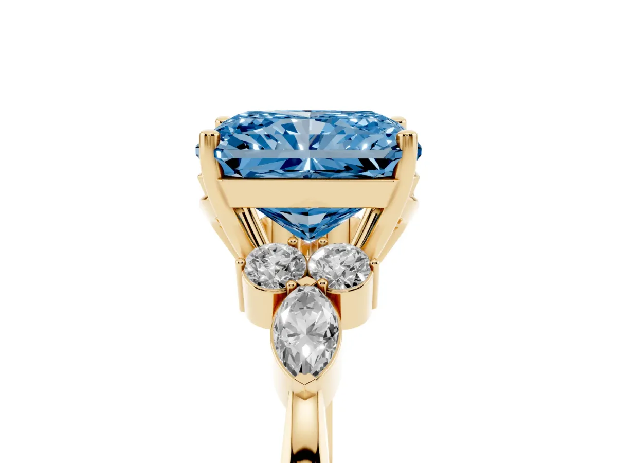 Fancy Blue Radiant Cut Brilliant Diamond Solitaire Ring with Pear Side Stones and Four-Prong Setting Yellow gold