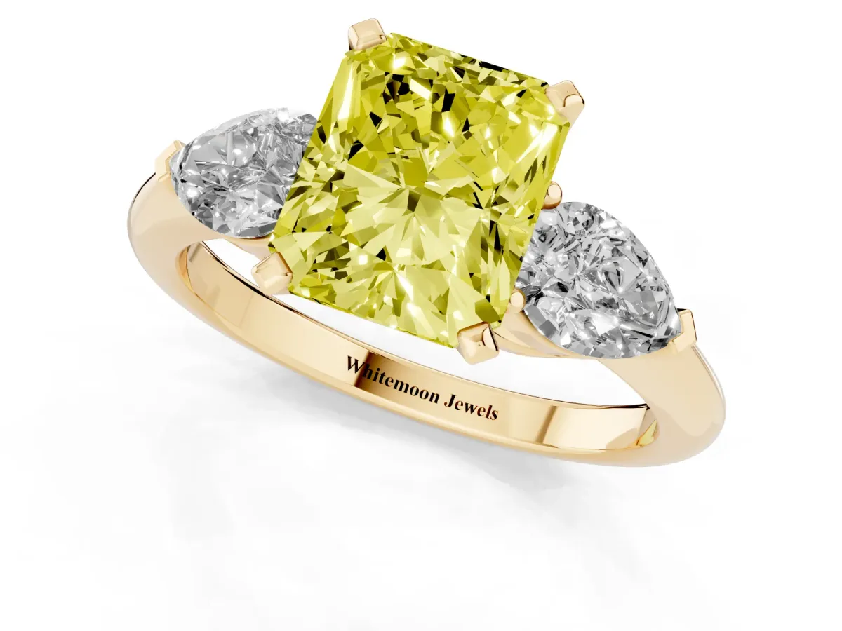 Fancy Yellow Three-Stone Radiant Cut Diamond Ring with Pear Side Stones and Four-Prong Setting Yellow gold
