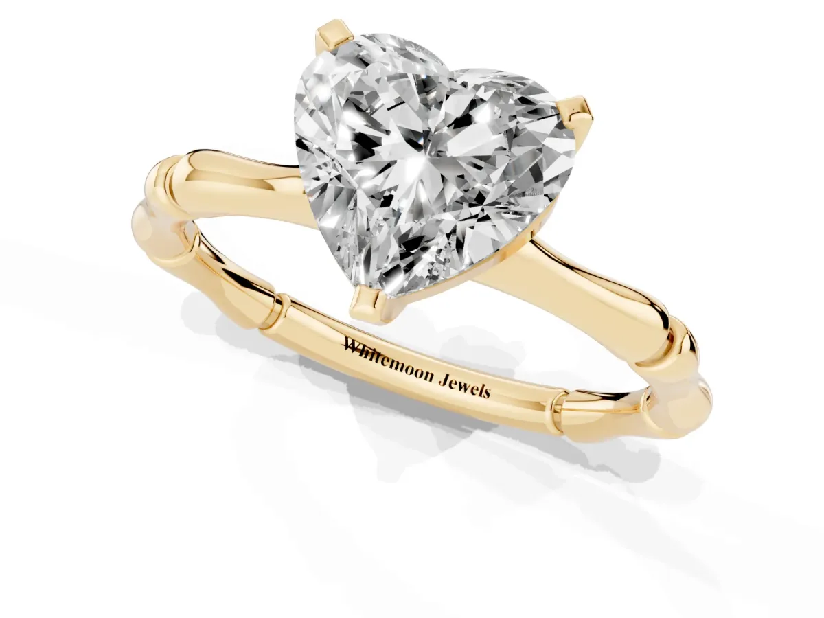 Heart Cut Solitaire Diamond Ring with Bamboo Band and Four-Prong Setting Yellow gold
