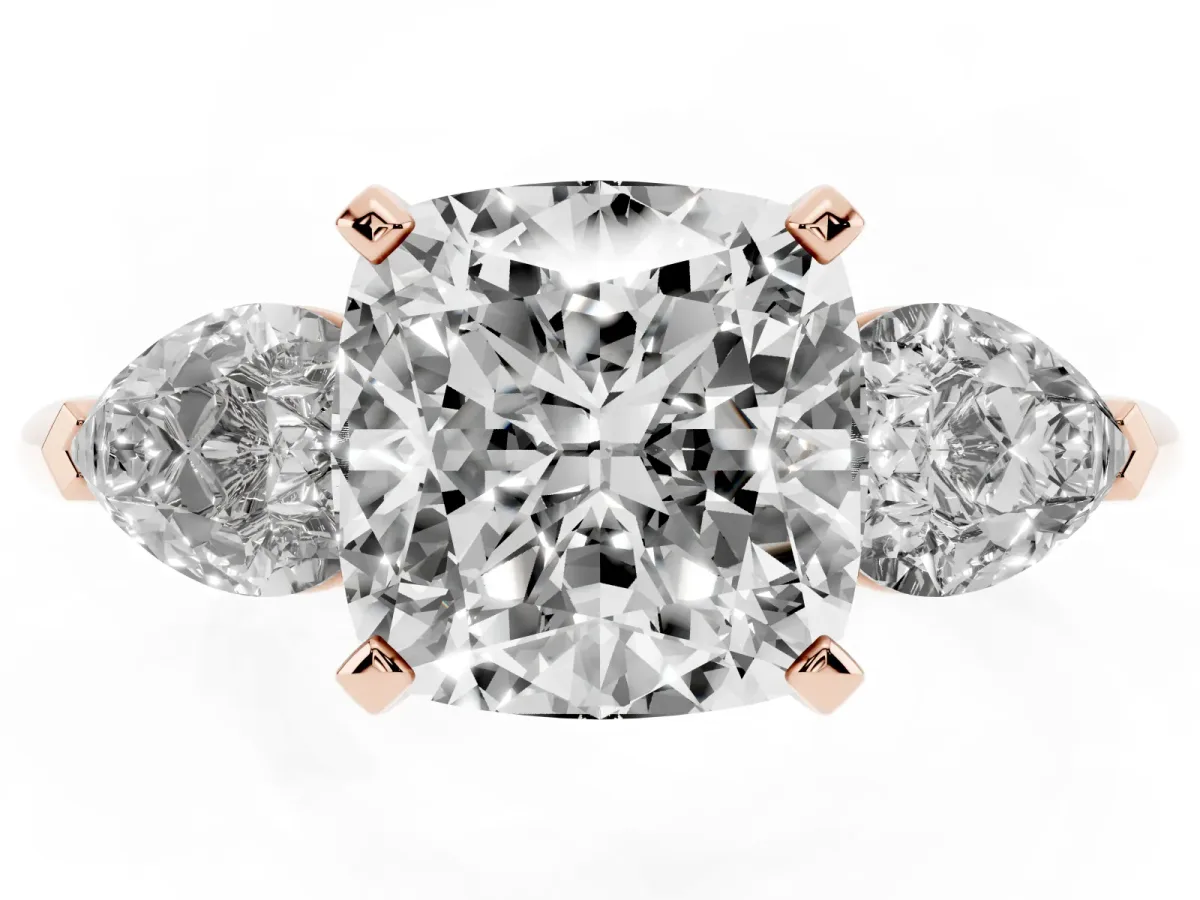 Three-Stone Cushion Cut Diamond Ring with Pear Side Stones and Four-Prong Setting Rose gold