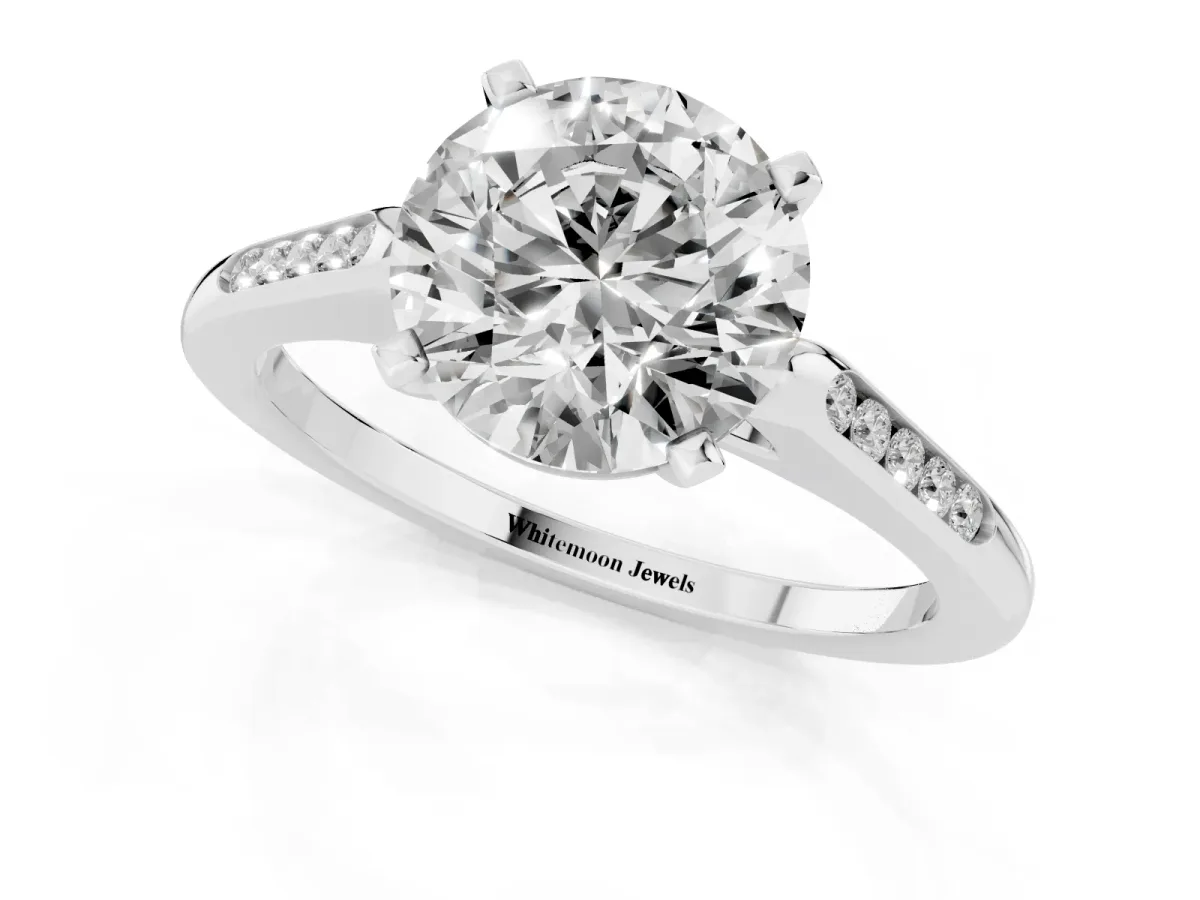 Round Cut Diamond Solitaire Ring with Channel Set Round Band and Prong Setting Silver