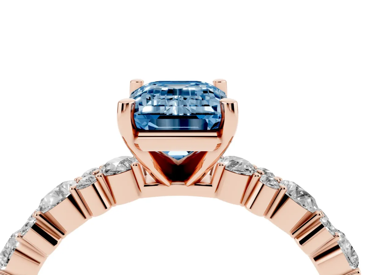 Fancy Blue Emerald Cut Diamond Side Stone Solitaire Ring with Round and Four-Prong Setting Rose gold