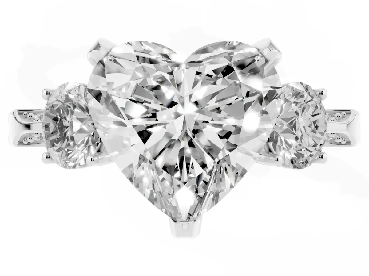 Heart Cut Brilliant Three-Stone Diamond Ring with Pavé Band and Four-Prong Setting Platinum