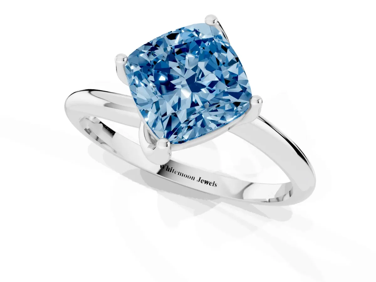 Fancy Blue Cushion Cut Diamond Solitaire Engagement Ring with Four-Prong Setting and Classic Band Silver