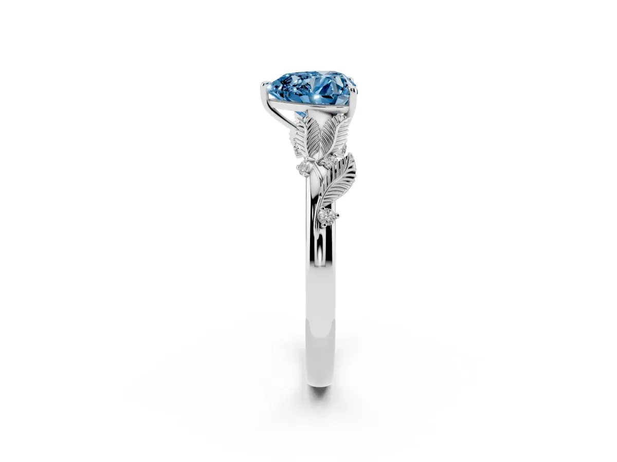 Fancy Blue Heart Cut Diamond Solitaire Ring with Leaf Motif Band and Four-Prong Setting Platinum
