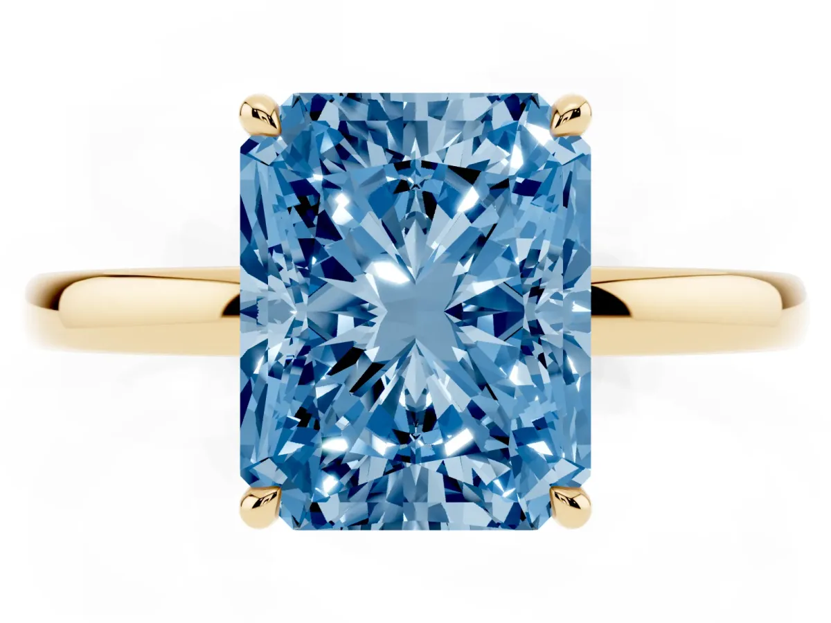 Fancy Blue Radiant Cut Solitaire Engagement Ring with Cathedral Band and Four-Prong Setting Yellow gold