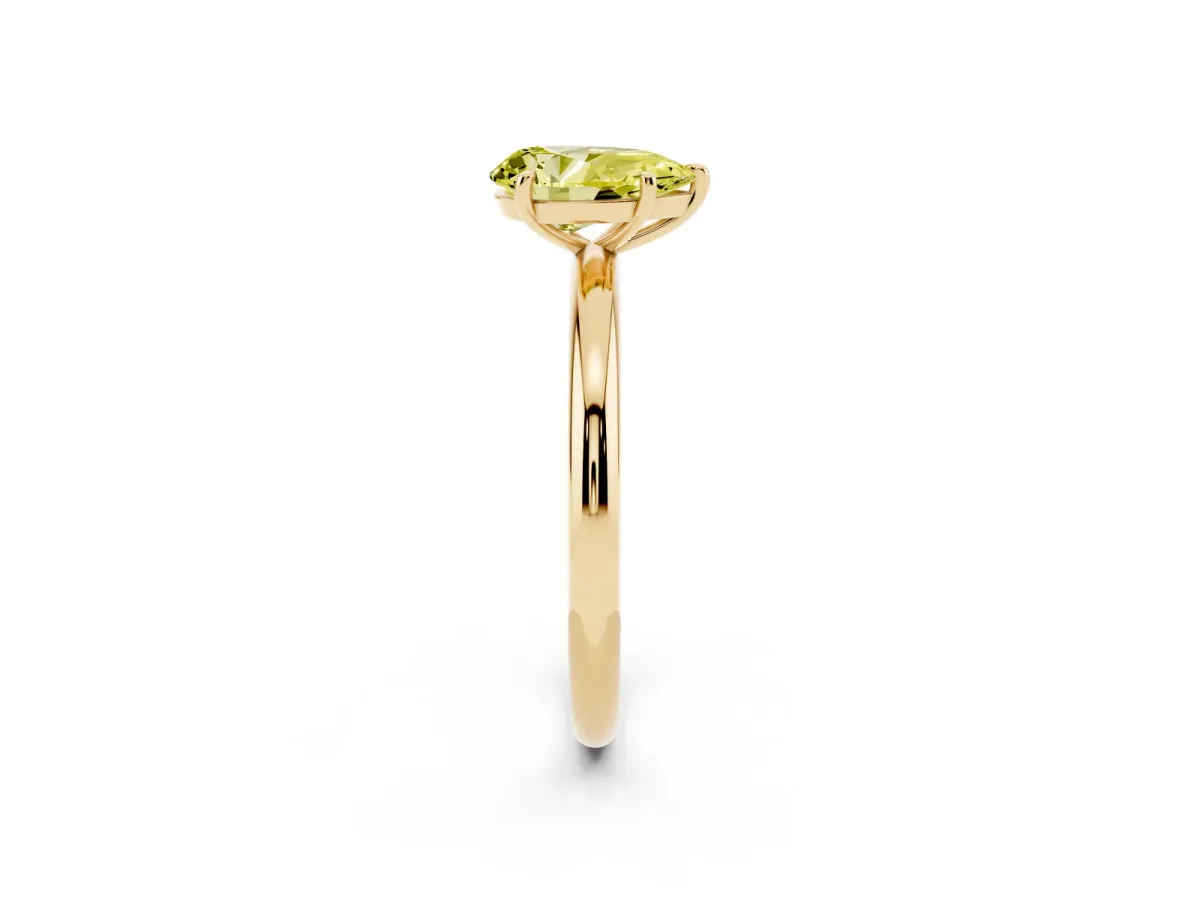 Fancy Yellow Pear Cut Solitaire Diamond Ring with Four-Prong Setting on a Plain Band Yellow gold