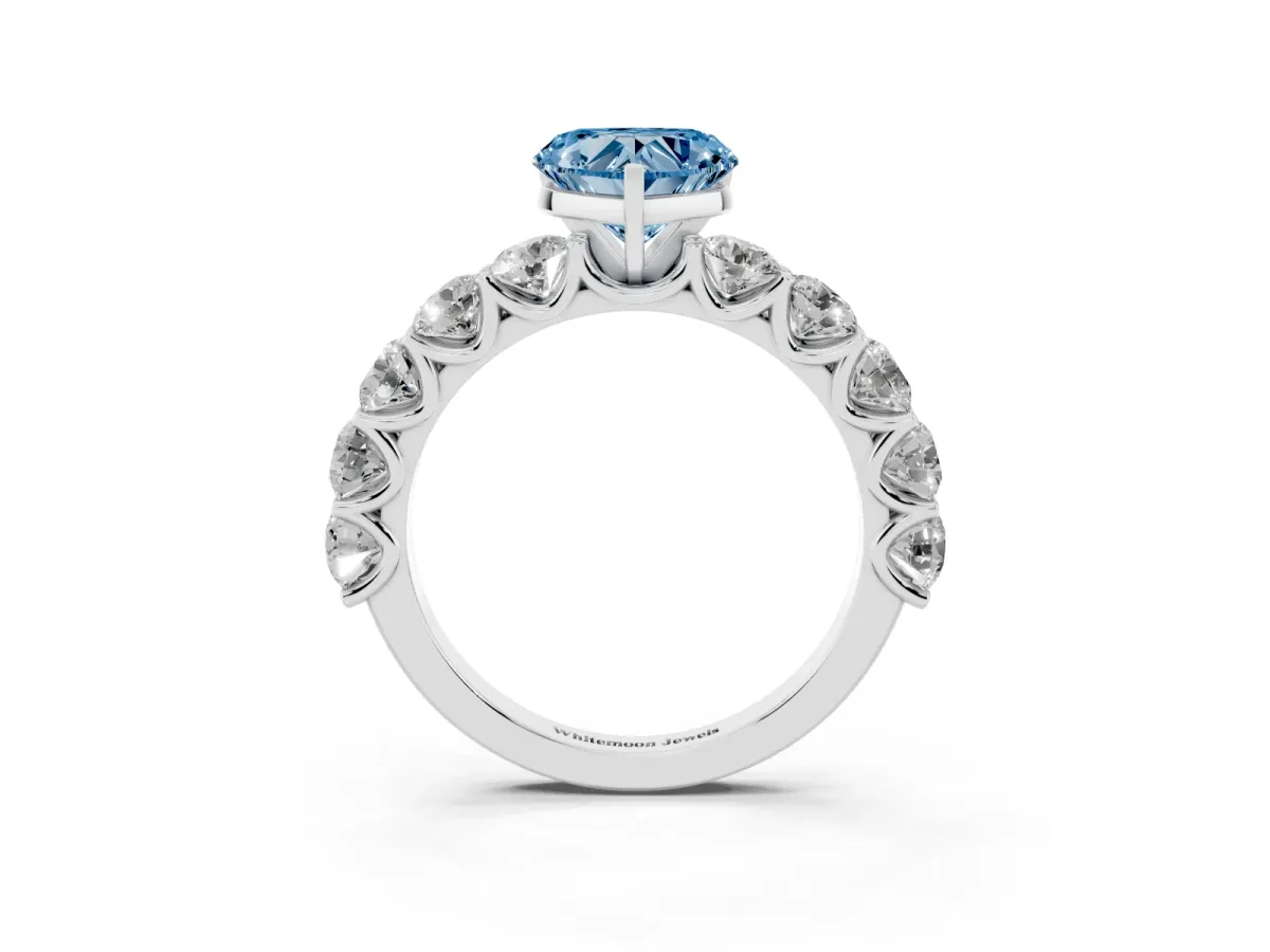 Fancy Blue Heart Cut Diamond Prong Setting with Side Stones on a Pave Band Silver
