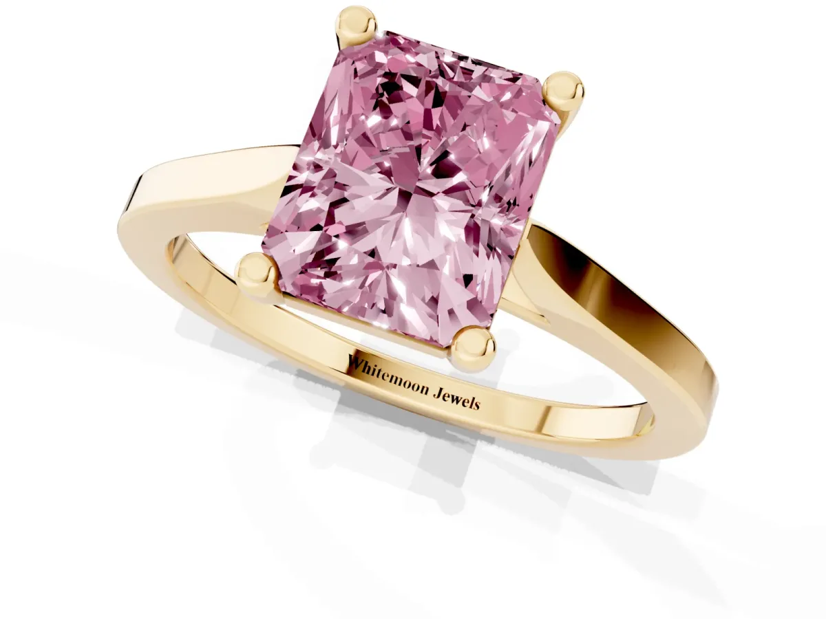 Fancy Pink Radiant Cut Solitaire Diamond Ring with Four-Prong Setting and Tapered Band Yellow gold