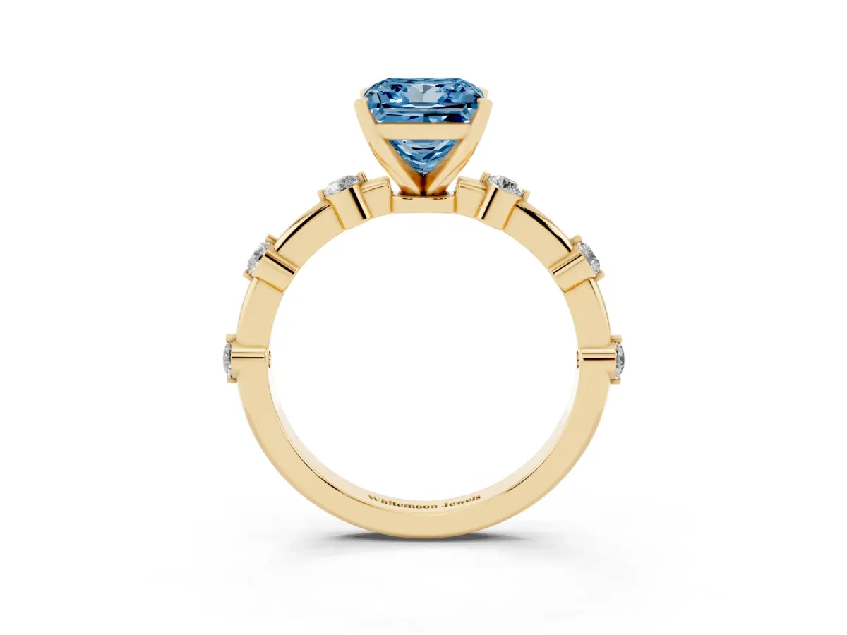 Fancy Blue Princess Cut Solitaire Diamond Ring with Bezel Set Side Stones and Prong Setting Yellow gold