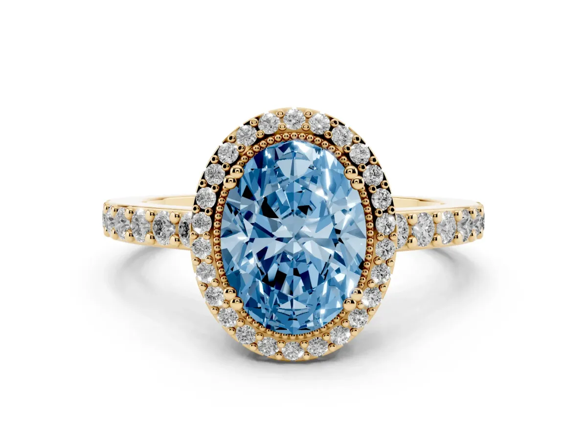 Fancy Blue Oval Cut Cut Diamond Halo Engagement Ring with Milgrain Detail and Pavé Band Yellow gold