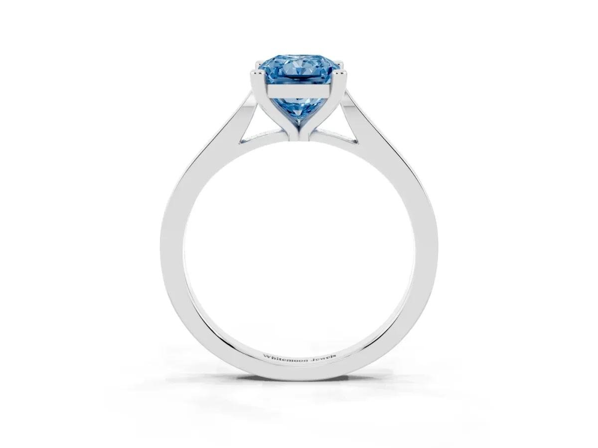 Fancy Blue Radiant Cut Solitaire Diamond Ring with Four-Prong Setting and Tapered Band Silver