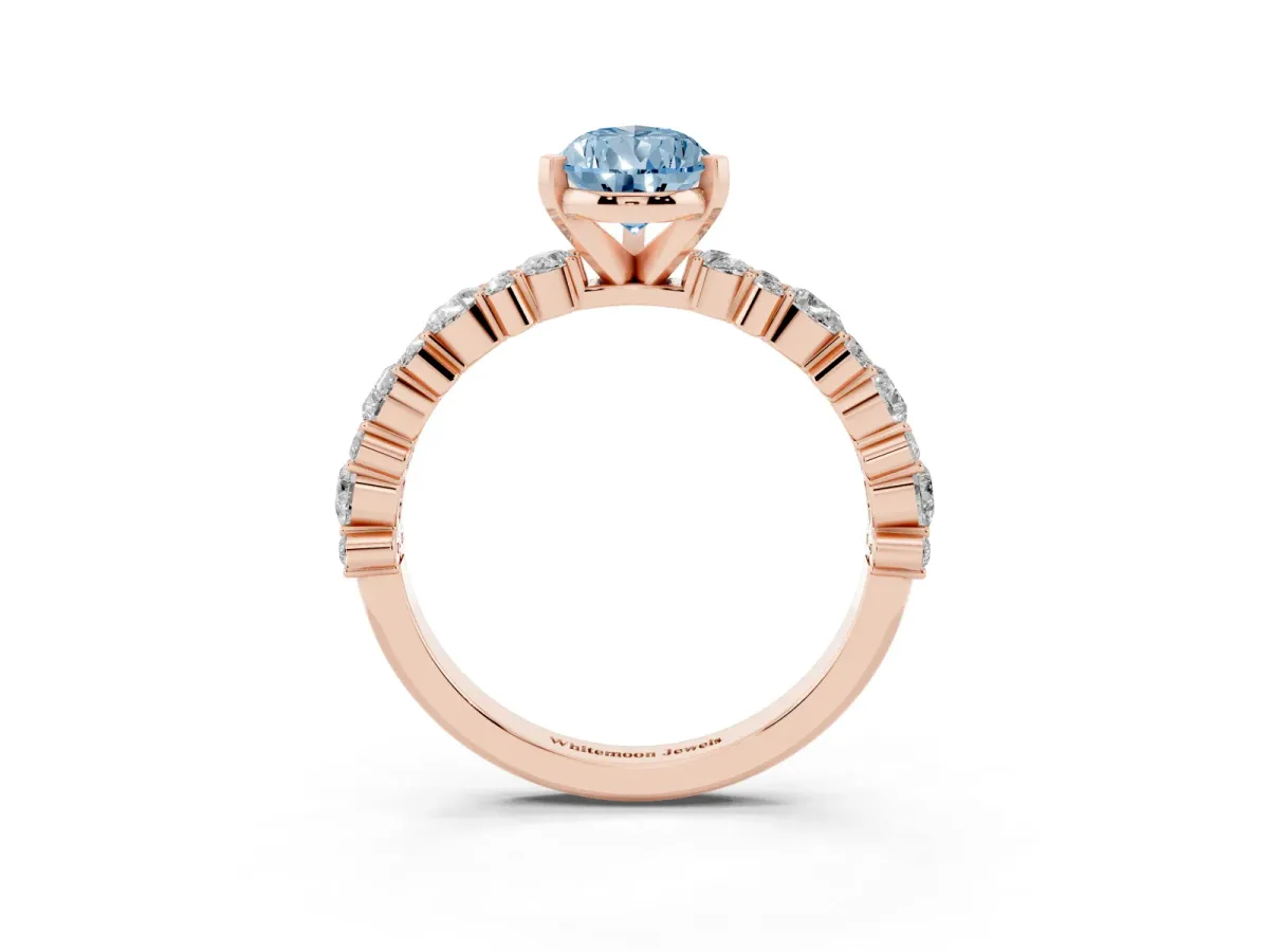 Fancy Blue Pear Cut Diamond Side Stone Solitaire Ring with Round and Four-Prong Setting Rose gold