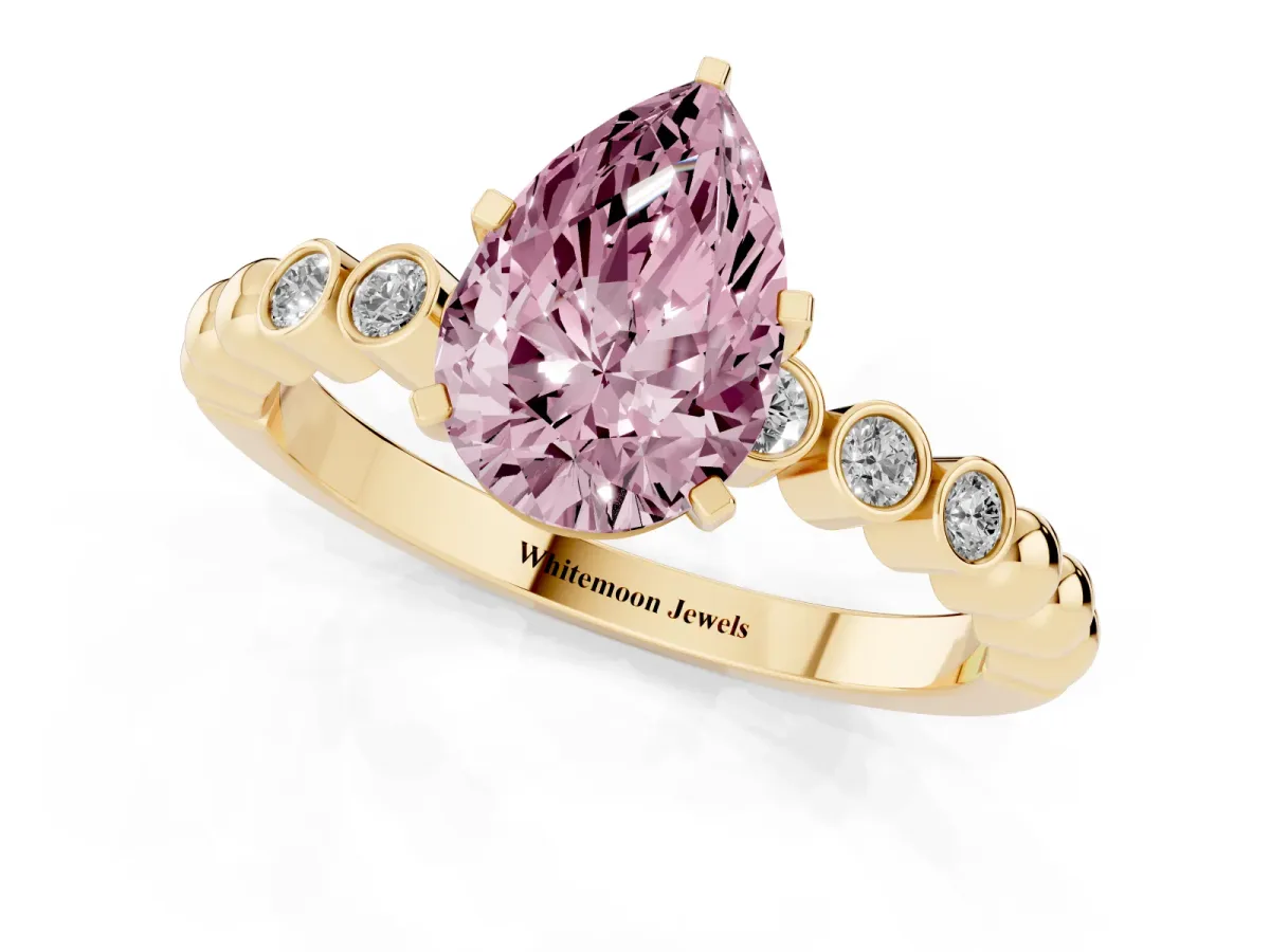 Fancy Pink Pear Cut Solitaire Bezel Accent Diamond Engagement Ring with Beaded Band and Four-Prong Setting Yellow gold
