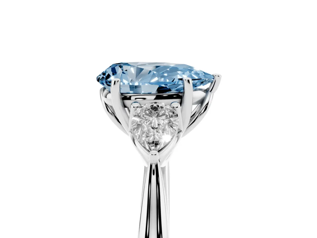 Fancy Blue Three-Stone Pear Cut Diamond Ring with Pear Side Stones in Four-Prong Setting Platinum