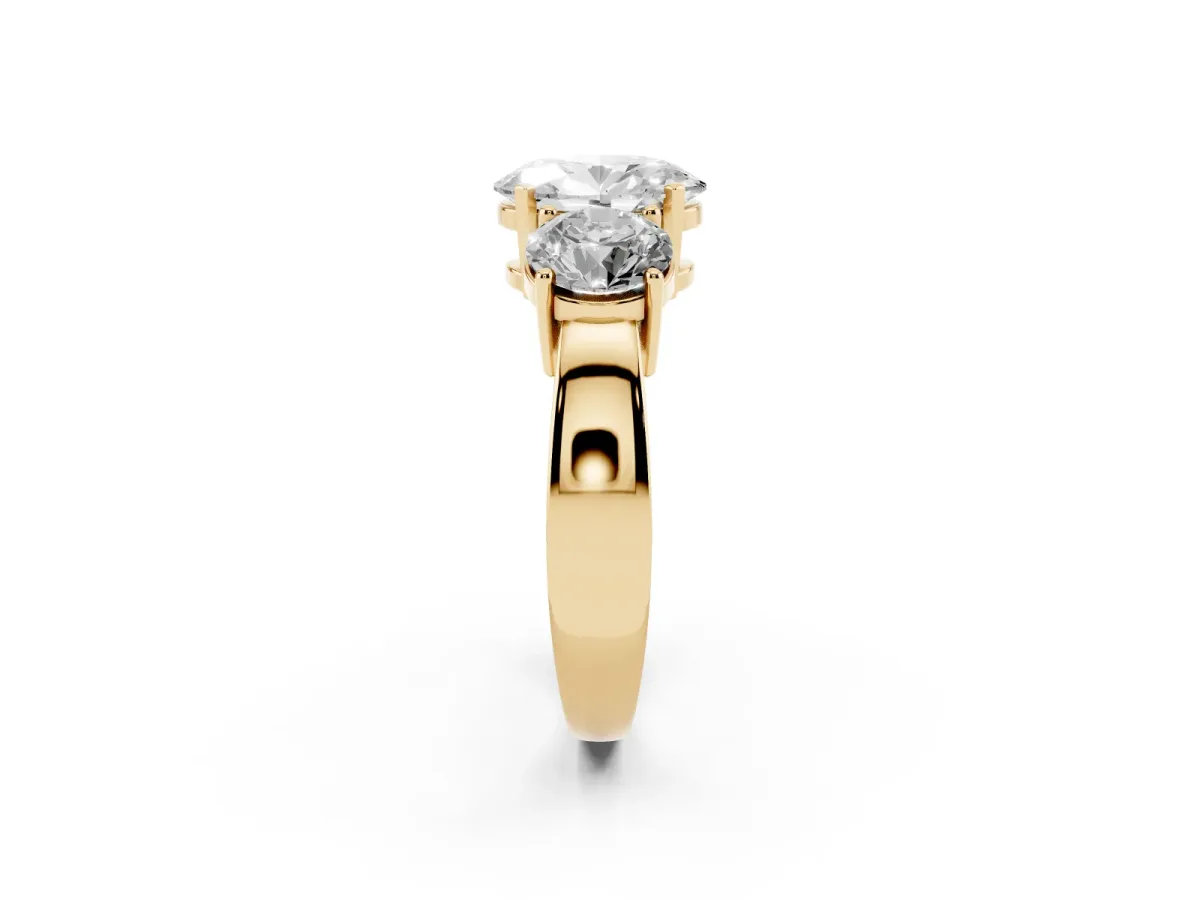 Three-Stone Oval Cut Diamond Ring with Round Side Stones, Classic Band, and Four-Prong Setting Yellow gold