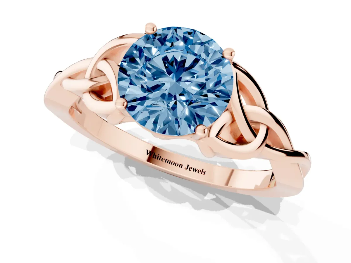 Fancy Blue Round Cut Diamond Solitaire Engagement Ring with Celtic Knot Band and Four-Prong Setting Rose gold