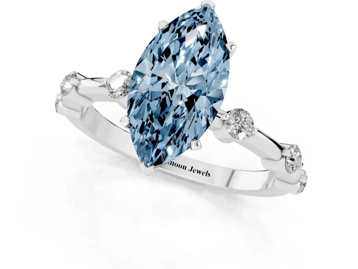 Fancy Blue Marquise Cut Solitaire Diamond Ring with Bezel Set Side Stones and Prong Setting Silver