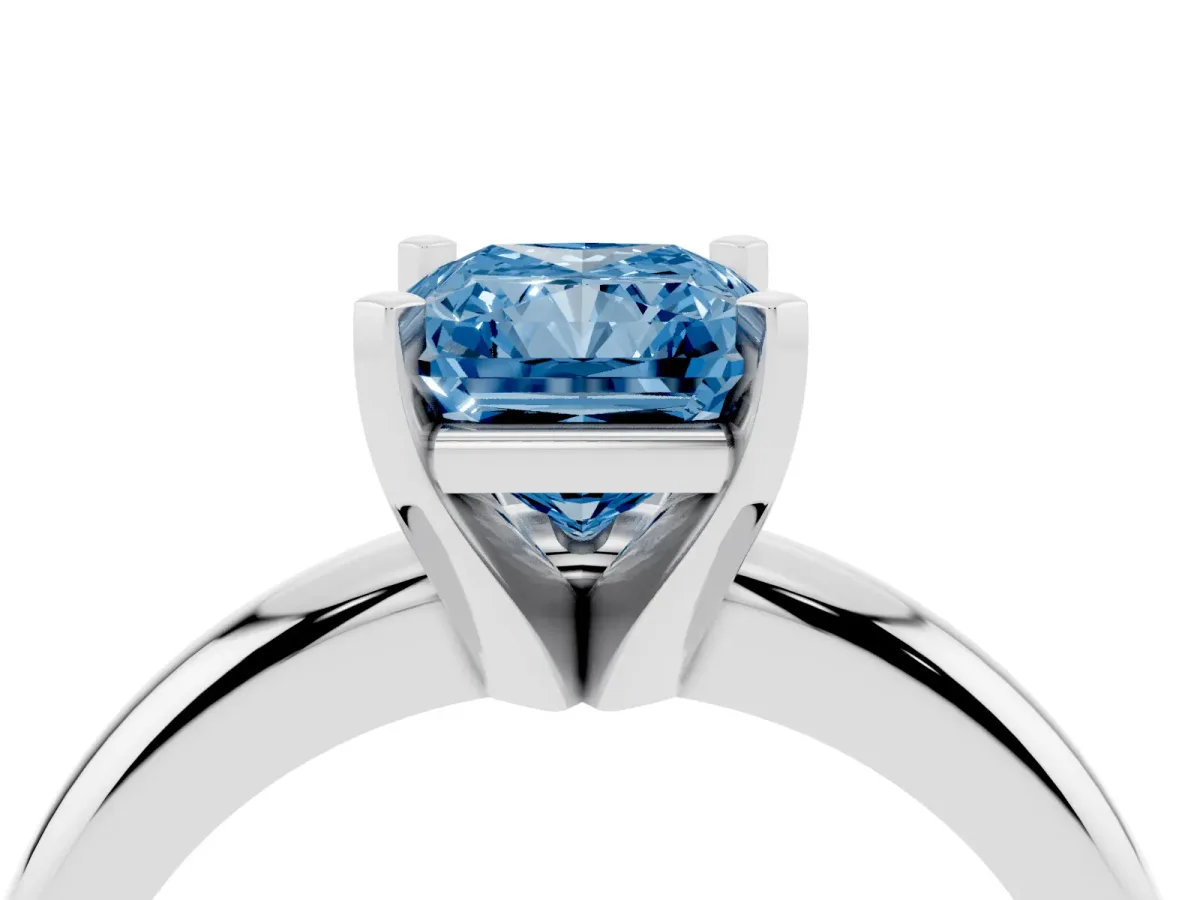 Fancy Blue Radiant Cut Diamond Solitaire Engagement Ring with Round Band and Four-Prong Setting Platinum