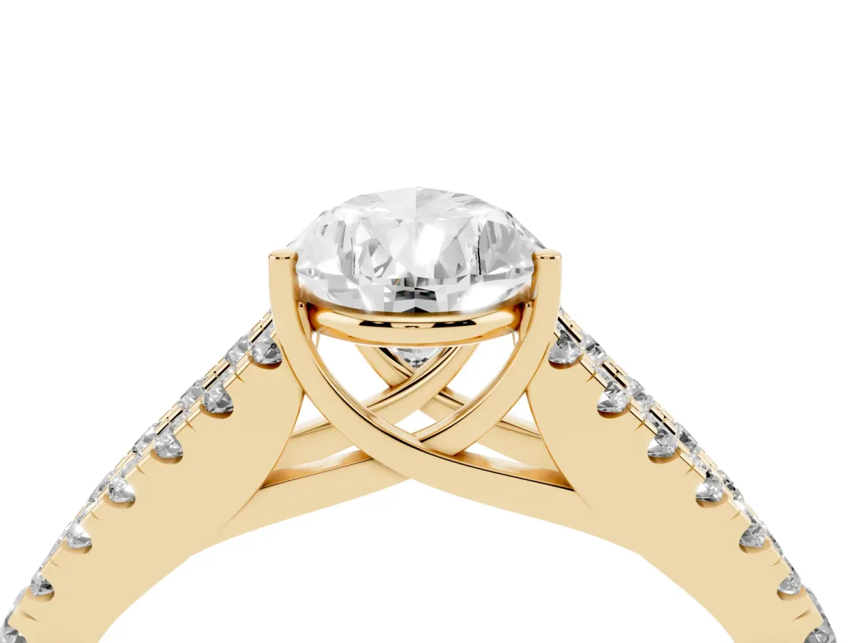 Pear Cut Diamond Split Shank Engagement Ring with Round Pavé and Prong Setting Yellow gold