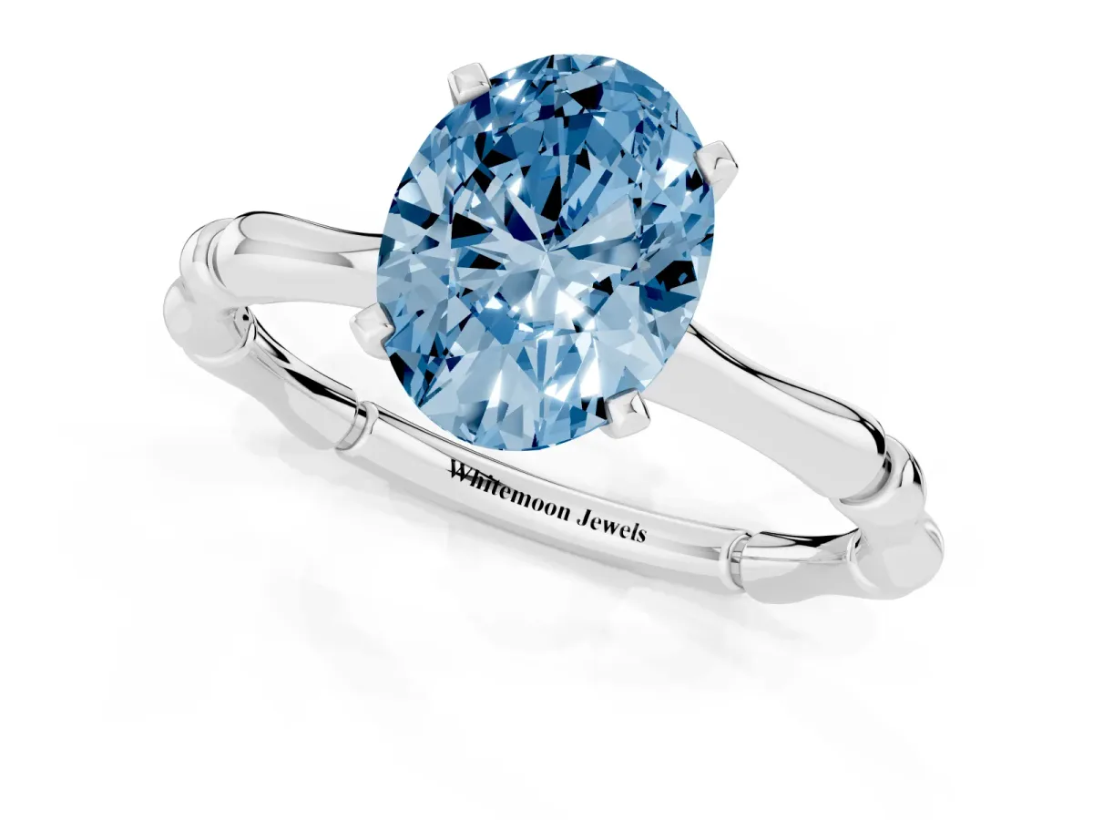 Fancy Blue Oval Cut Solitaire Diamond Ring with Bamboo Band and Four-Prong Setting Silver