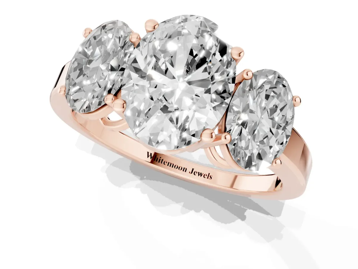 Three-Stone Oval Cut Cut Diamond Engagement Ring with Flat Band and Four-Prong Setting Rose gold