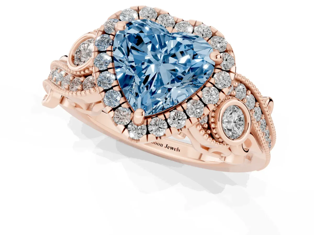 Fancy Blue Heart Cut Halo Diamond Ring with Milgrain and Bezel Accents on a Split Shank Band Rose gold