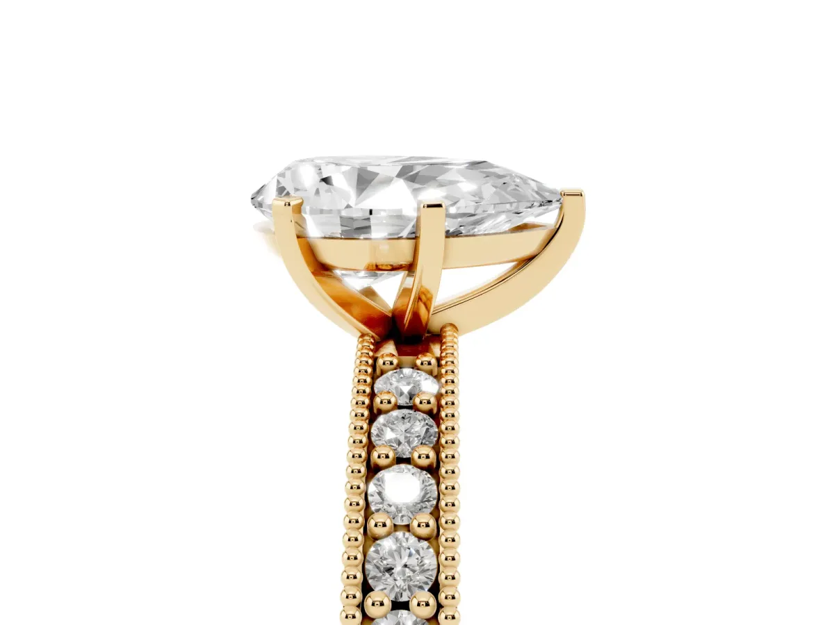 Pear Cut Diamond Milgrain Pavé Engagement Ring with Four-Prong Setting Yellow gold