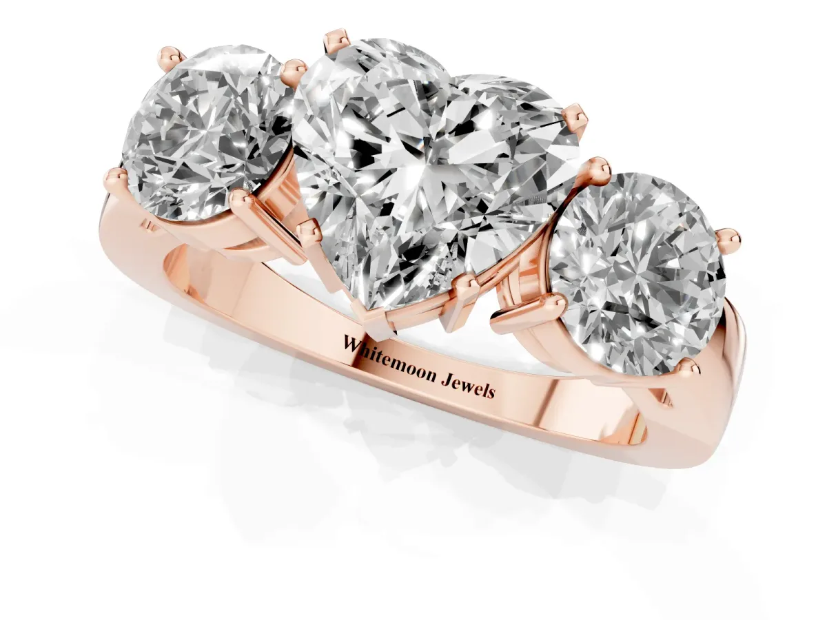 Three-Stone Heart Cut Diamond Ring with Round Side Stones, Classic Band, and Four-Prong Setting Rose gold